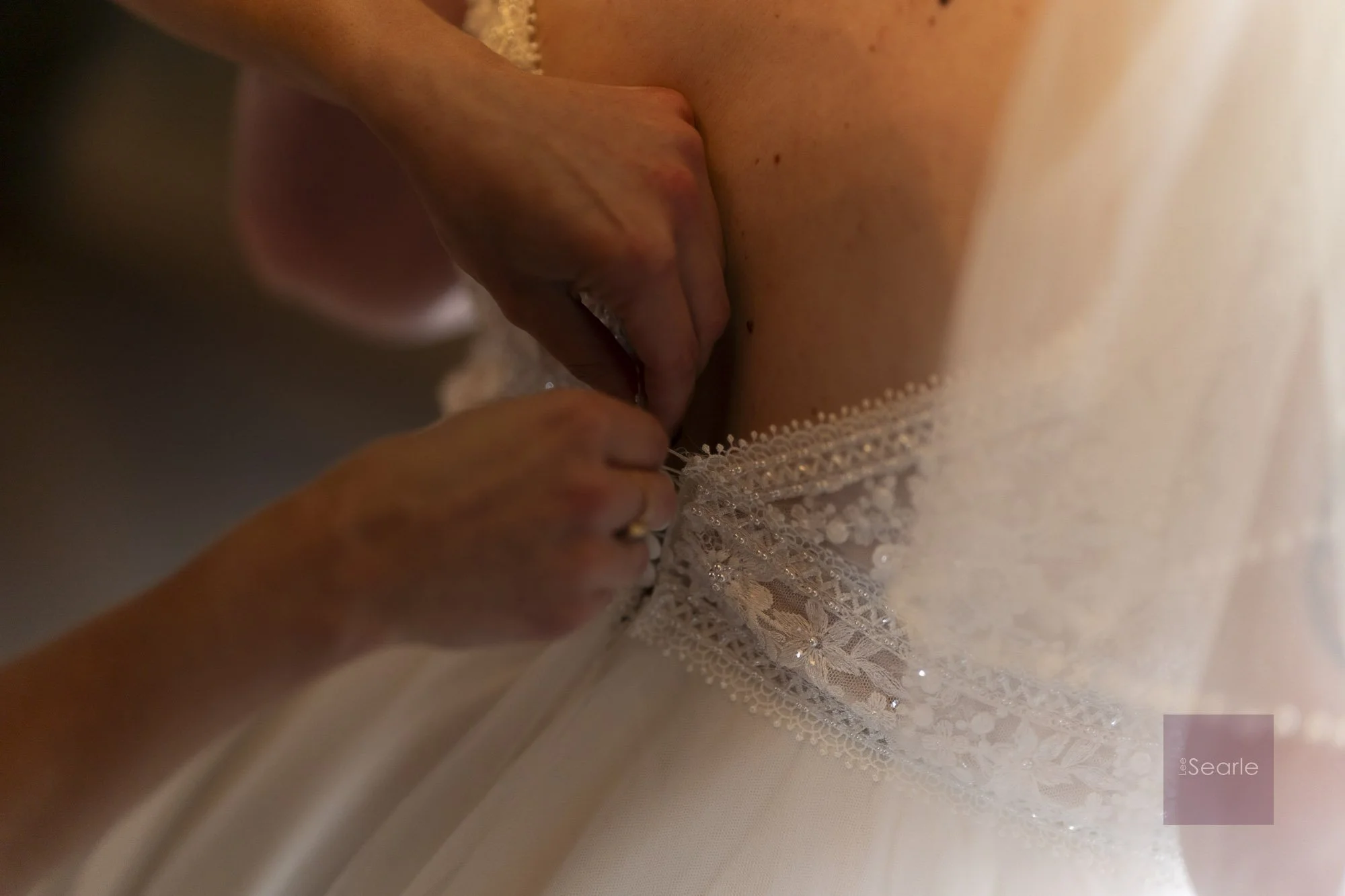 Lacing the dress on the wedding morning