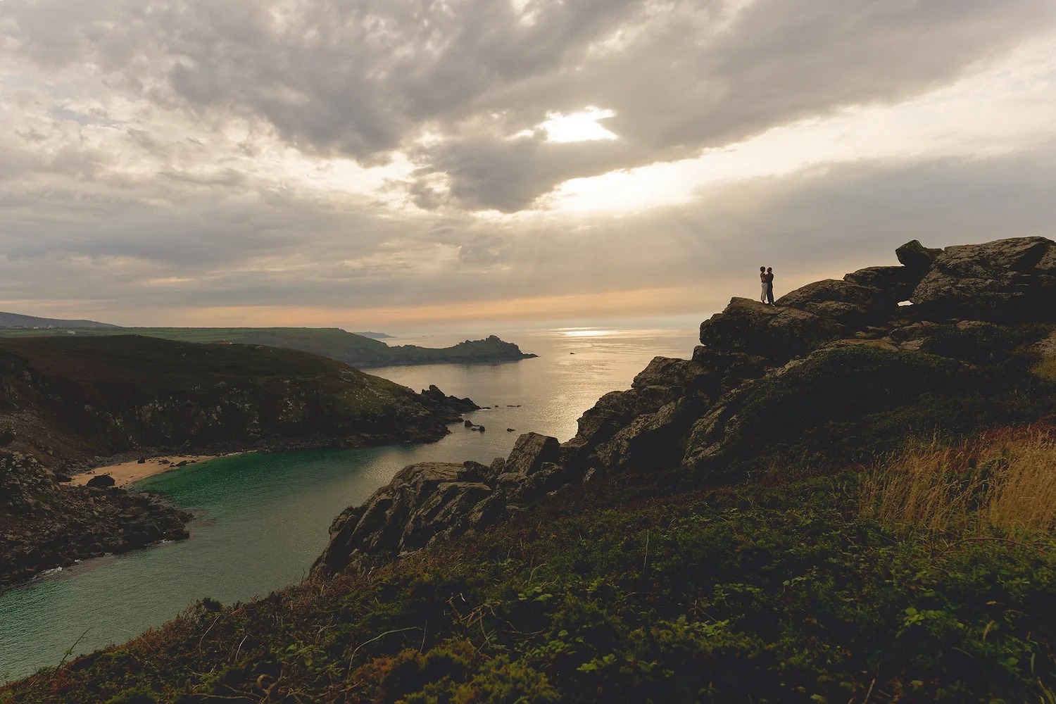 Zennor clifftop wedding at sunset Couple embracing on Zennor clifftops at sunset during a Cornwall wedding