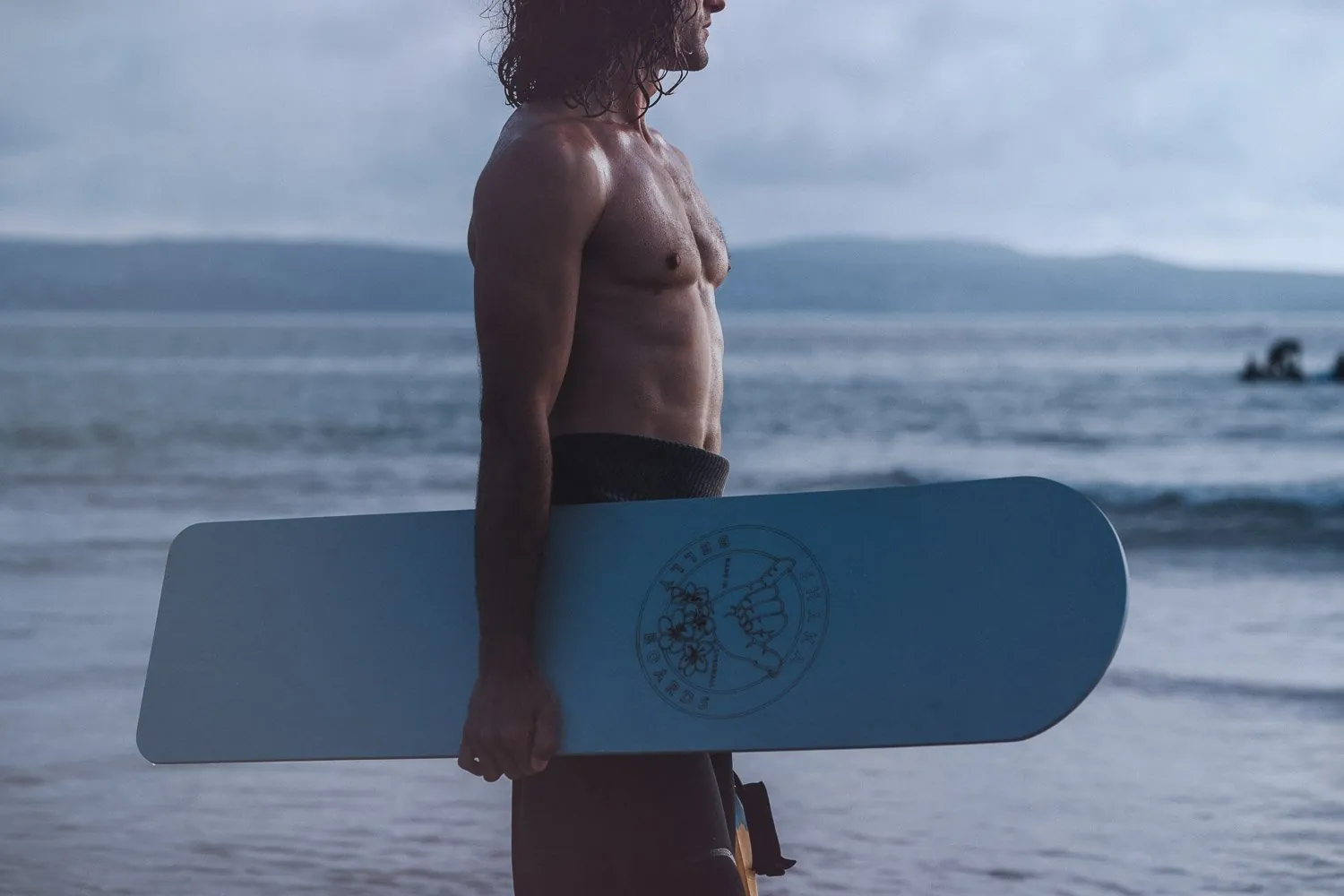Bodyboard brand photography on a Cornish beach at first light